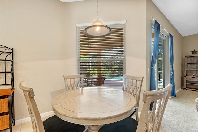 dining room featuring light carpet