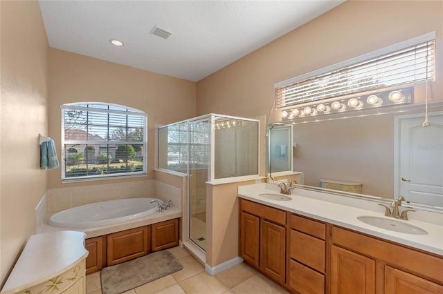 bathroom featuring shower with separate bathtub, tile patterned floors, and vanity