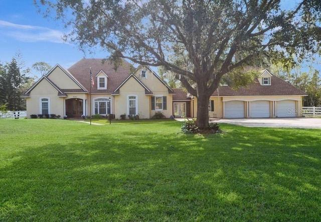 view of front facade featuring a garage and a front lawn