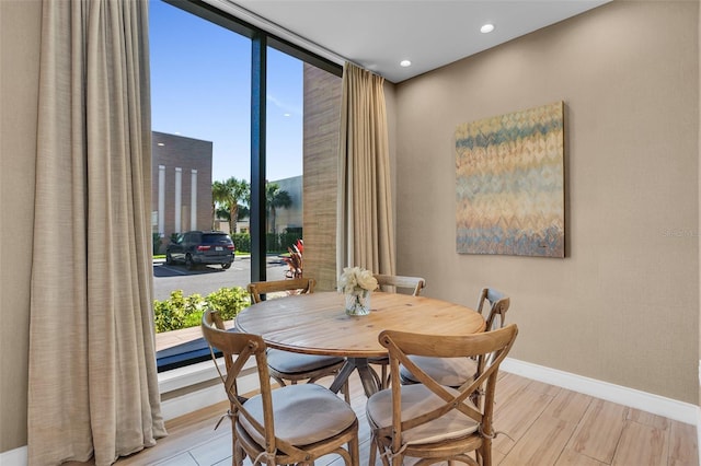 dining area with light hardwood / wood-style flooring