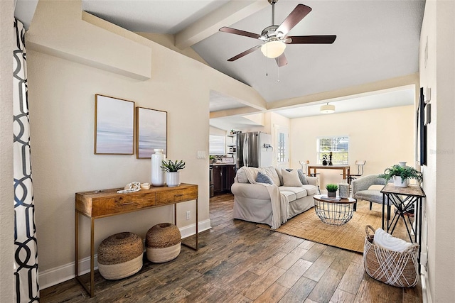 living room featuring vaulted ceiling with beams, dark hardwood / wood-style floors, and ceiling fan