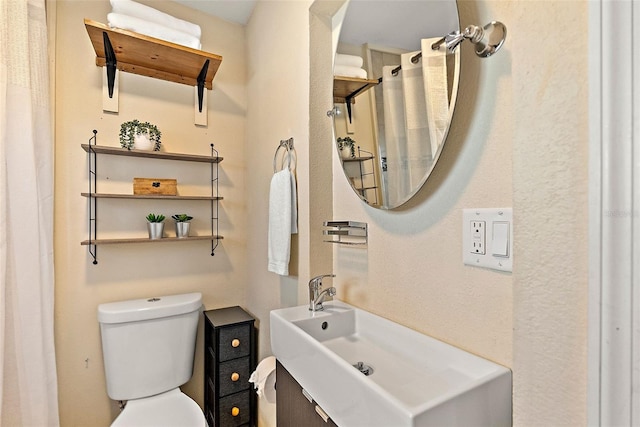 bathroom with toilet and sink