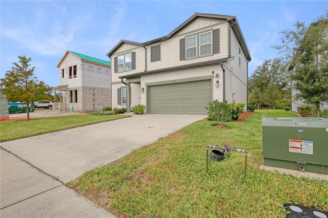 view of front of home with a garage and a front yard