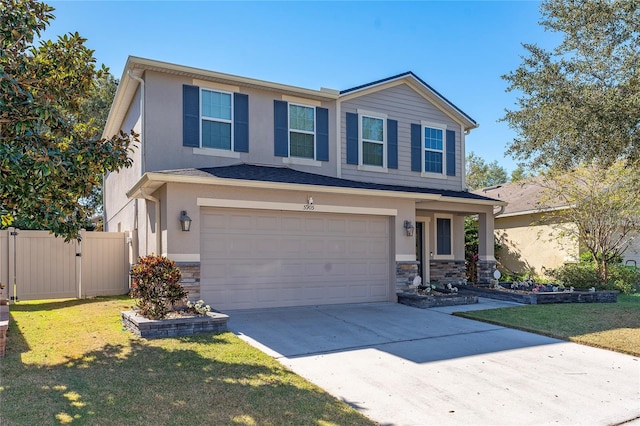 view of front of house with a garage and a front lawn