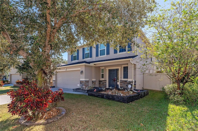 view of front of property with a front lawn and a garage