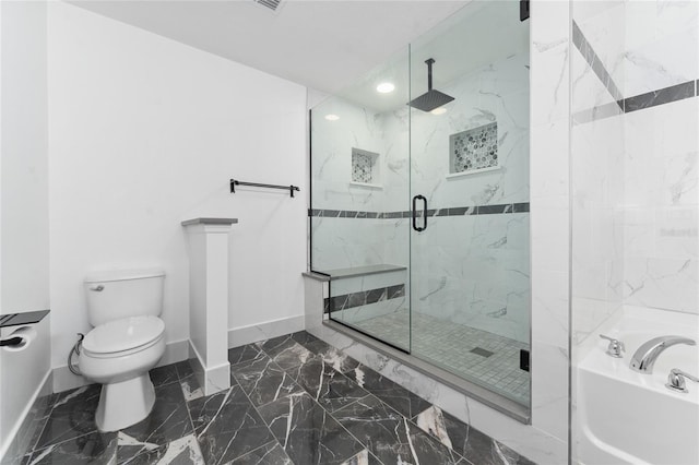 bathroom with toilet and shower with separate bathtub