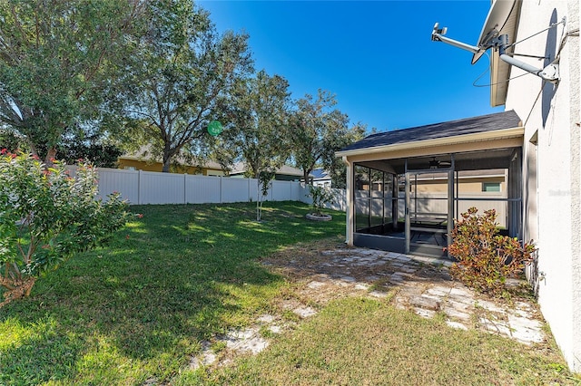 view of yard featuring a sunroom