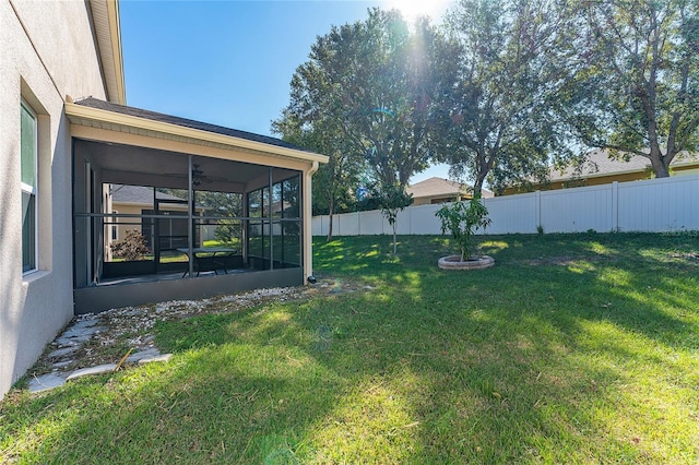 view of yard featuring a sunroom