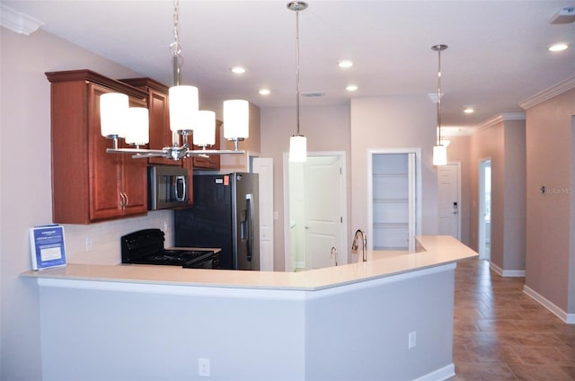 kitchen featuring hanging light fixtures, kitchen peninsula, decorative backsplash, appliances with stainless steel finishes, and ornamental molding