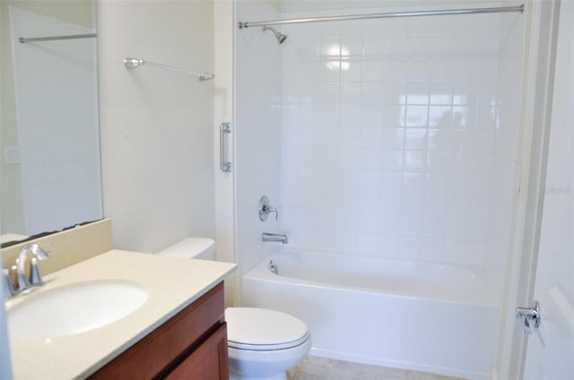 full bathroom with vanity, toilet, and tiled shower / bath