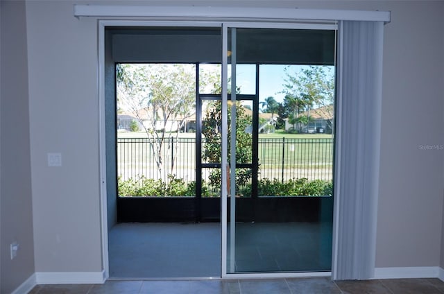 entryway featuring a wealth of natural light and tile patterned flooring