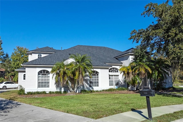 view of front of home with a front lawn