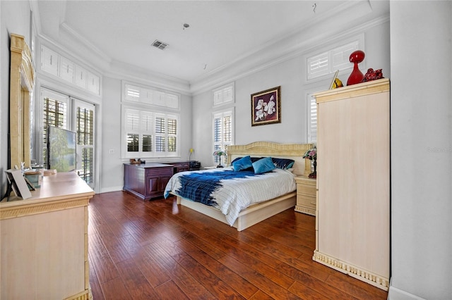 bedroom featuring access to exterior, dark hardwood / wood-style flooring, and ornamental molding