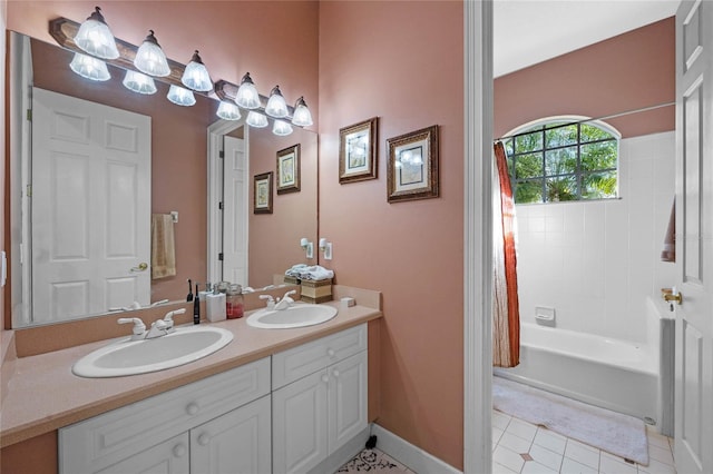 bathroom featuring tile patterned flooring, vanity, and shower / bath combo