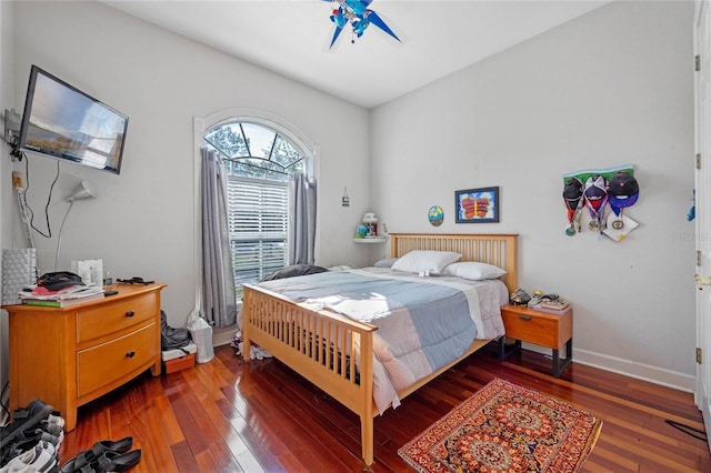 bedroom featuring ceiling fan and dark hardwood / wood-style floors