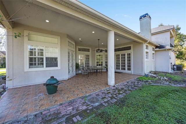 view of patio featuring ceiling fan, central air condition unit, and french doors