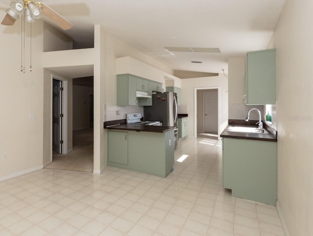 kitchen with green cabinets, sink, white electric stove, vaulted ceiling, and ceiling fan