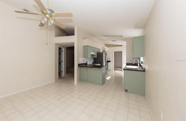 kitchen with ceiling fan, sink, white electric range, green cabinets, and stainless steel fridge