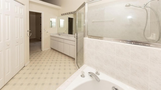 bathroom featuring shower with separate bathtub and vanity