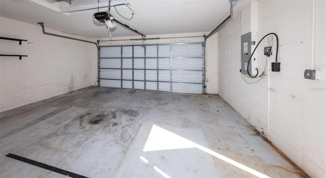 garage featuring a garage door opener and electric panel