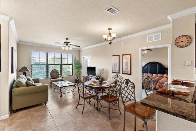 tiled living room with a textured ceiling, sink, ceiling fan with notable chandelier, and ornamental molding