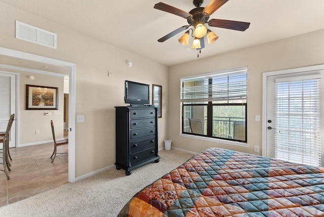 bedroom featuring ceiling fan and light colored carpet