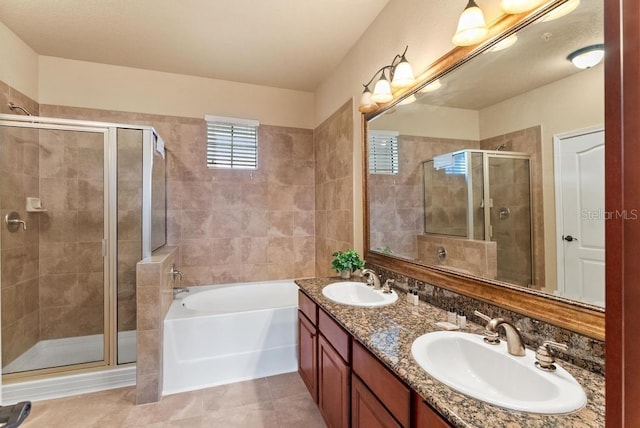 bathroom featuring tile patterned flooring, vanity, and plus walk in shower