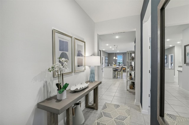 corridor featuring light tile patterned flooring