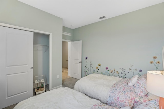 bedroom with a closet and carpet floors