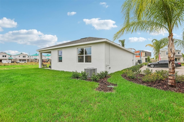 view of property exterior with a lawn and central air condition unit