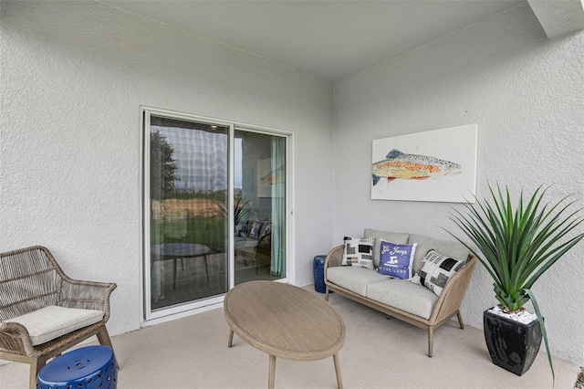 sitting room featuring carpet