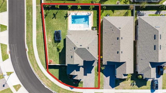 4381 Davos Dr, Clermont, FL 34711 - aerial overview of property's location featuring a pool area and property boundaries highlighted