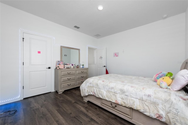 bedroom featuring dark hardwood / wood-style floors