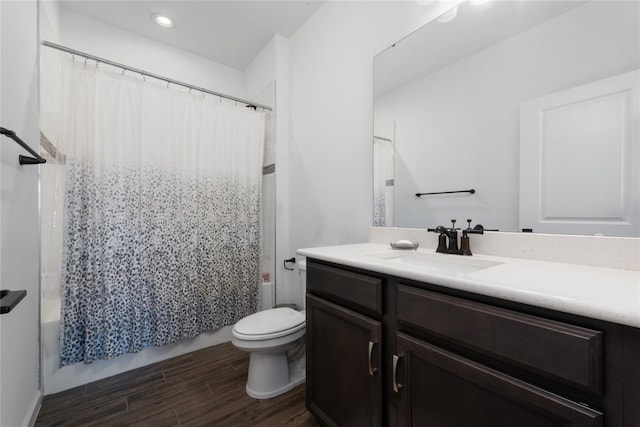 full bathroom with vanity, shower / bath combination with curtain, and toilet