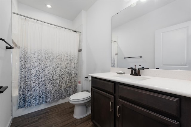 4381 Davos Dr, Clermont, FL 34711 - full bathroom featuring vanity, wood finished floors, toilet, shower / bath combo with shower curtain, and recessed lighting