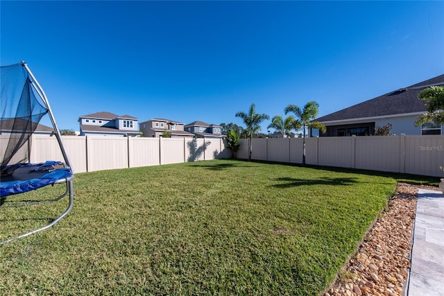 4381 Davos Dr, Clermont, FL 34711 - view of yard featuring a residential view and a trampoline