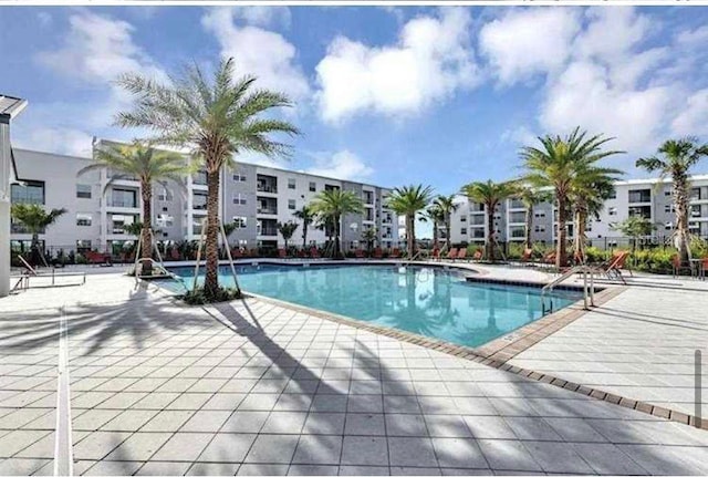 view of pool featuring a patio