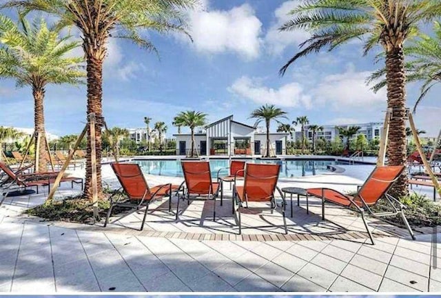 view of swimming pool featuring a patio area