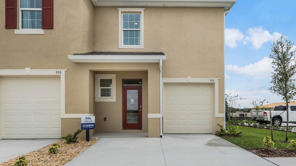 view of exterior entry featuring a garage