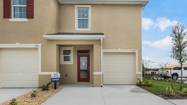 view of exterior entry featuring a garage