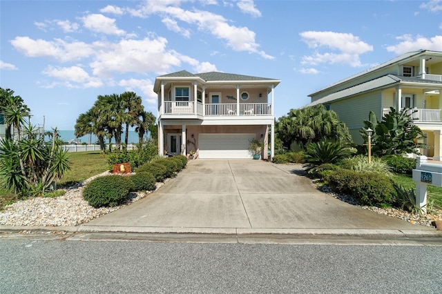 raised beach house featuring a garage