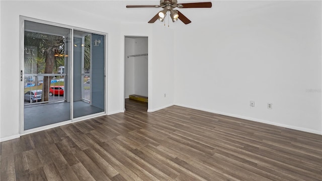 interior space with dark hardwood / wood-style floors and ceiling fan