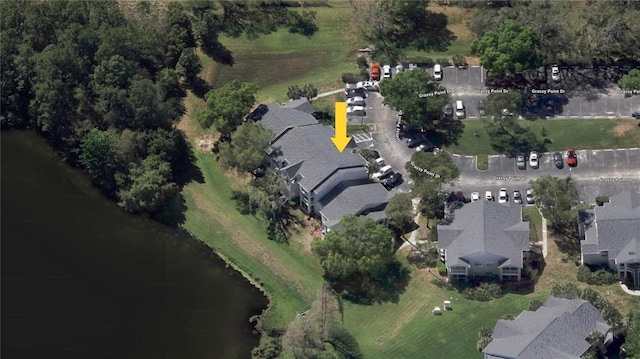 birds eye view of property featuring a water view