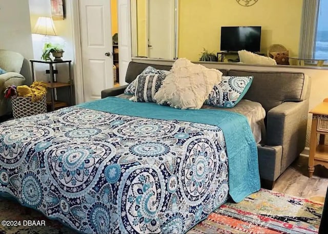 bedroom featuring wood finished floors