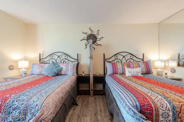 bedroom with wood finished floors