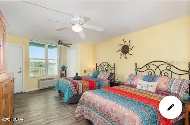 bedroom featuring radiator heating unit, a ceiling fan, and wood finished floors