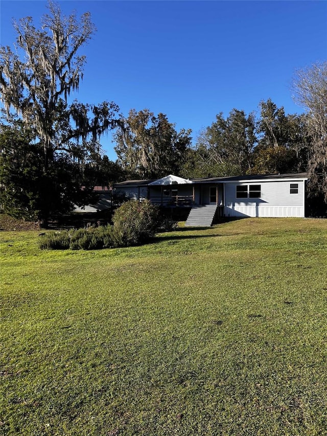 view of front of home with a front lawn