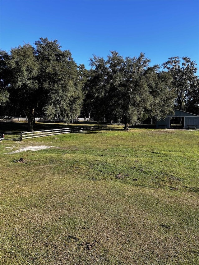 view of yard with a rural view