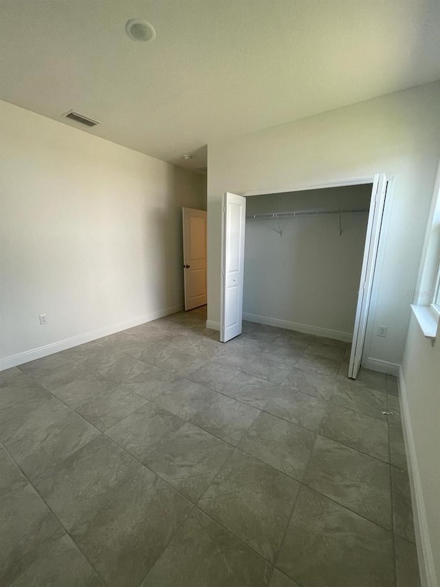 unfurnished bedroom featuring a closet