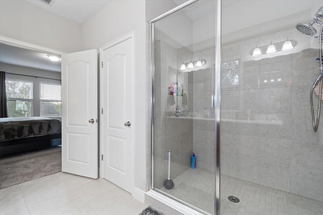 bathroom featuring tile patterned floors and an enclosed shower